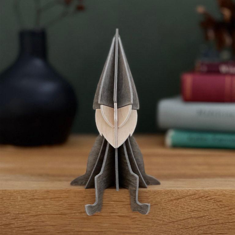 Lovi Elf, grey, on bookshelf