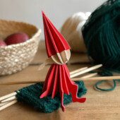 Lovi Elf Girl, wooden elf figure, sitting on the knitting, color bright red