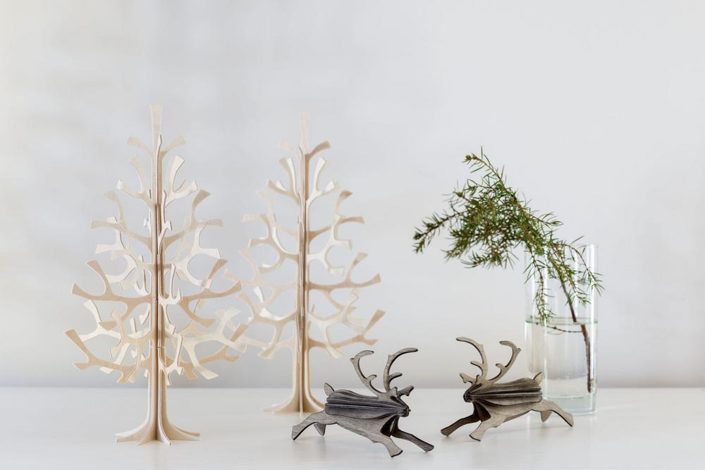 Christmas decorations brighten the hallway. Lovi Spruces 25cm and Lovi Reindeer on side table. 
