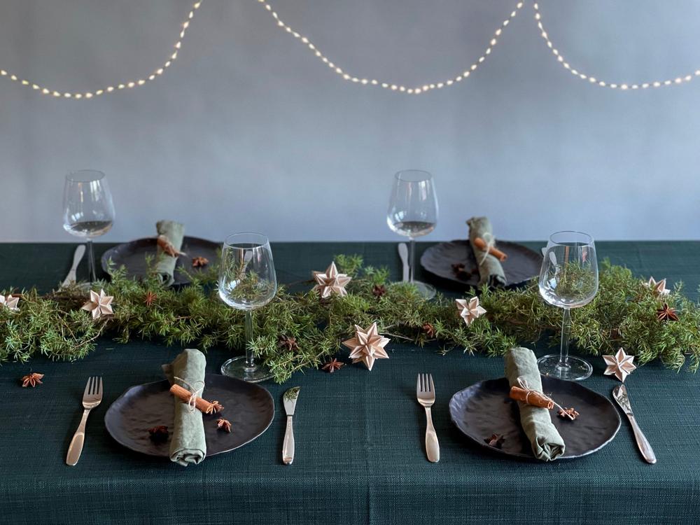 Christmas decorations can be used on table setting too. Lovi Stars, natural wood, as a part of Christmas dinner setting.