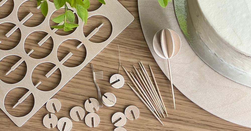 Natural wood Lovi baubles as wooden cake toppers