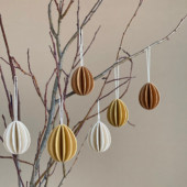 Wooden Easter Eggs by Lovi hanging on the branch, six Easter eggs in colors natural wood, honey yellow and cinnamon brown