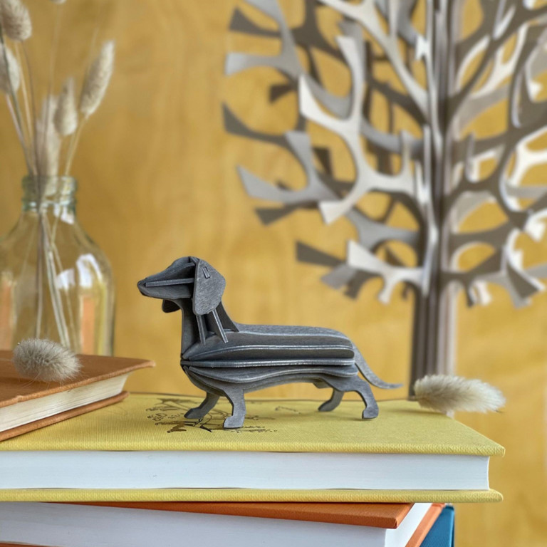 Lovi Dachshund, wooden dachshund figure, grey, on books