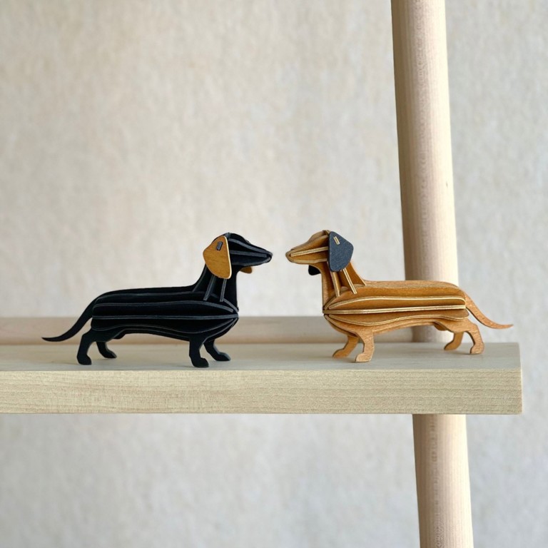 Lovi Dachshunds, wooden dachshund figures, black and cinnamon brown.