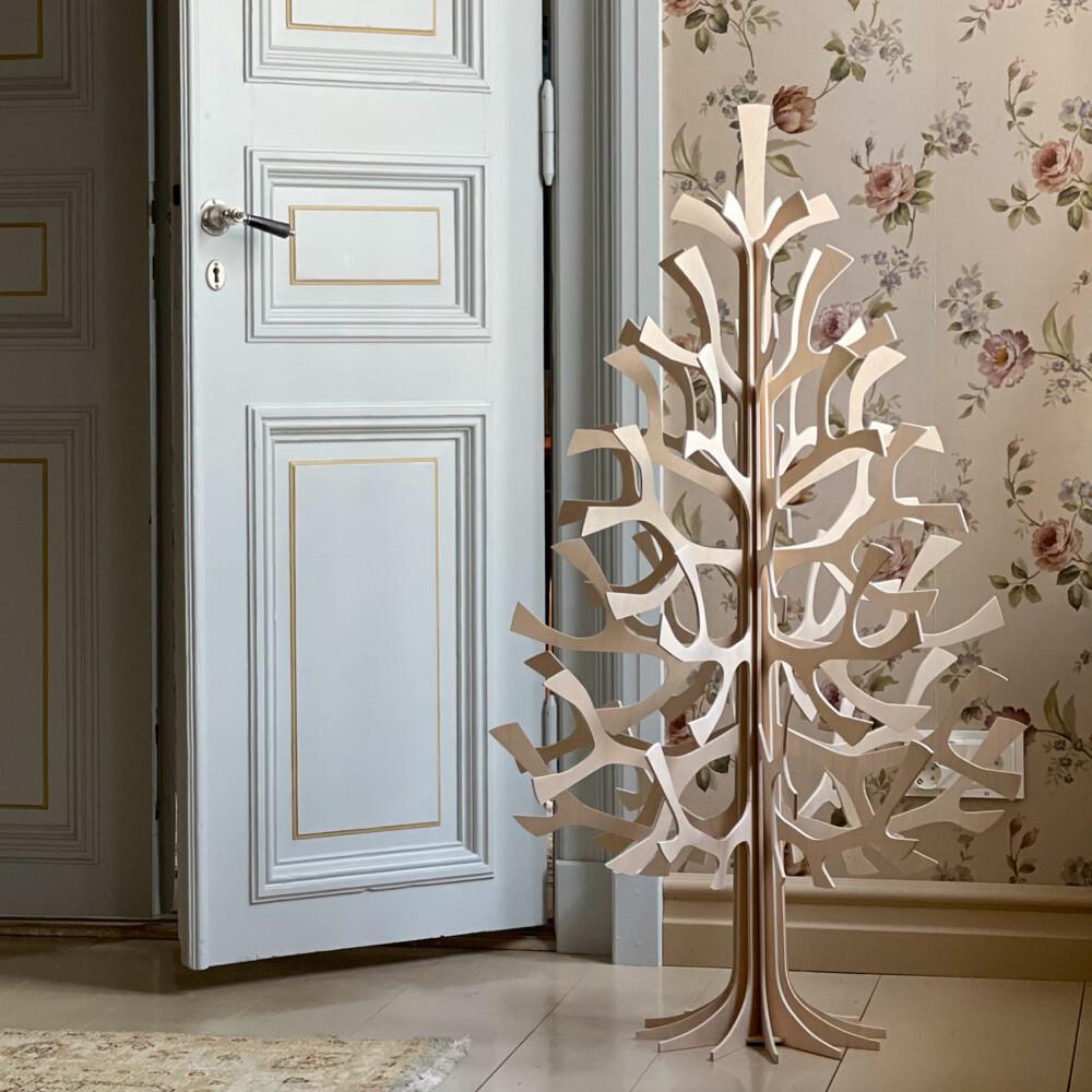 Lovi Spruce 120cm, wooden Christmas tree, in the corner of an old house. Color natural wood