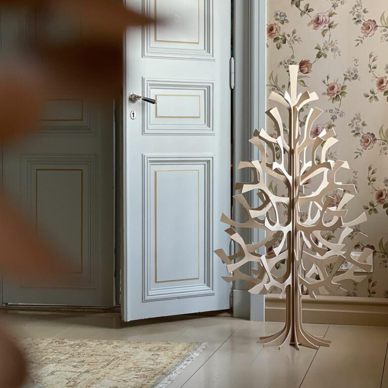 Lovi Spruce 120cm, wooden Christmas tree, in the corner of an old house. Color natural wood.