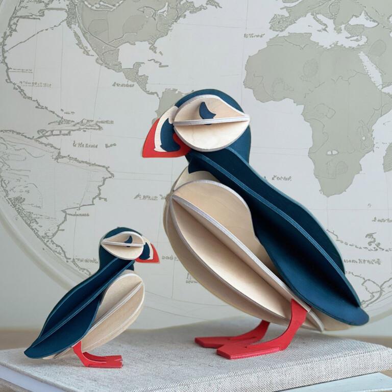 Wooden Lovi Puffins 10cm and 20cm, blue mix, on books