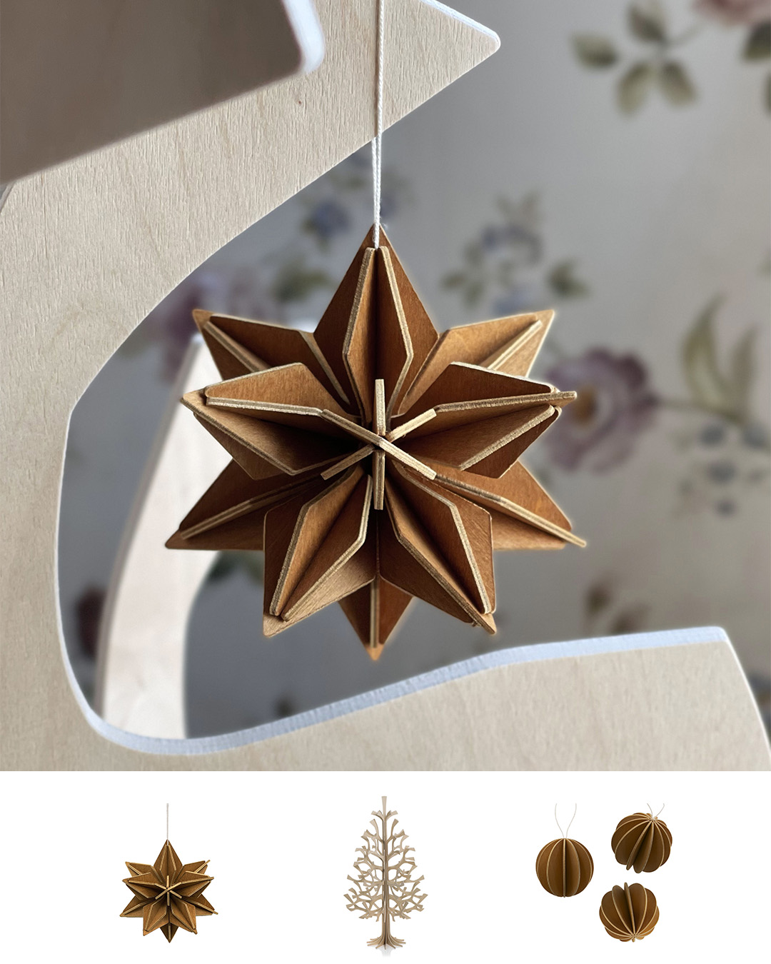 Wooden ornaments, cinnamon brown Lovi Star and Lovi Baubles, and Lovi Spruce in natural wood