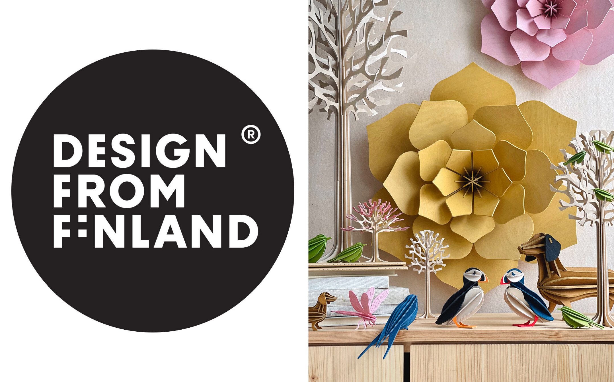 Wooden Lovi Products – Trees, Birds and Dogs – on sidetable and Lovi Decor Flowers on the wall. Design from Finland.