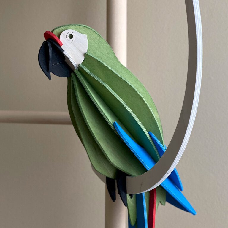 Lovi Parrot Green - Great Green Macaw, wooden decorative parrot sitting on the wooden crescent.