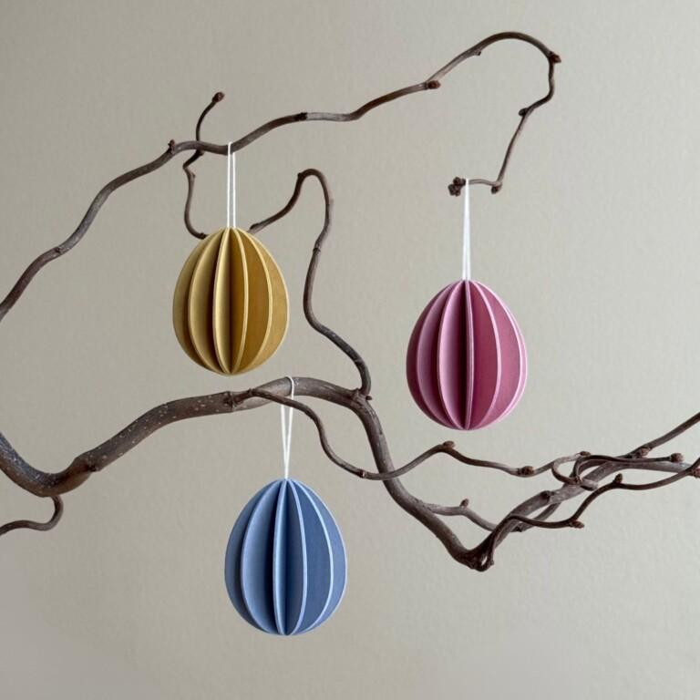 Lovi Eggs 7 cm, 3 pcs, wooden Easter eggs hanging on the branch. Color mix (honey yellow, light pink, flax blue).