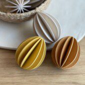 Lovi Eggs 7 cm, 3 pcs, wooden Easter eggs on table. Golden mix (cinnamon brown, honey yellow, natural wood).