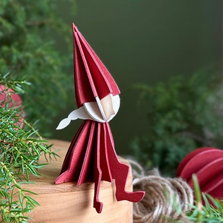 Lovi Elf Girl 12cm, color rustic red, sitting on wooden box. Wooden elf figure for home decor.